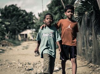 Two boys standing side by side 