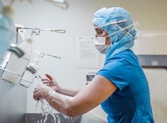 Doctor washing hands before procedure